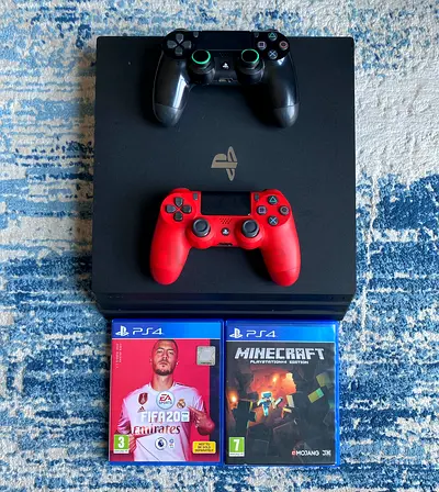 PlayStation 4 Pro 1Tb With 2 Controllers + 2 Games