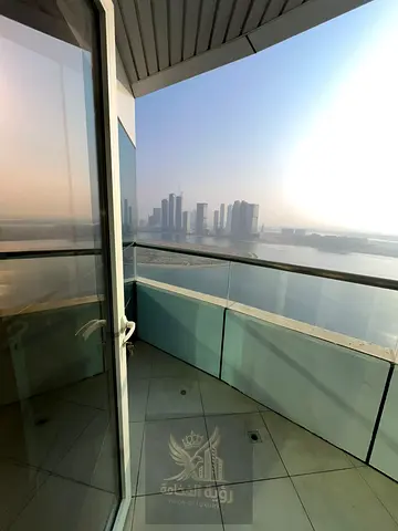 Beautiful two-master-bedroom apartment with a living room in Al Khan, featuring two balconies and a stunning sea view in the heart of the waterfront.