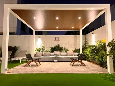 Modern outdoor pergola with built-in seating and lighting