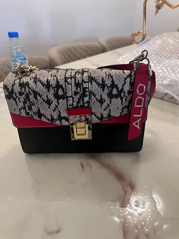 Black and snakeskin print crossbody bag with gold clasp