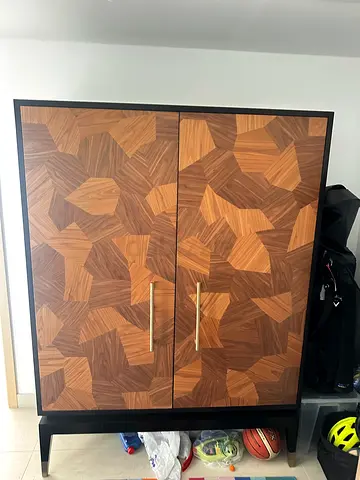 Custom made Wooden Two-Door Bar Cabinet with Geometric Veneer Finish and marble lining.