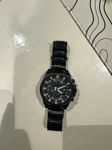 Black men's chronograph wristwatch with metal bracelet