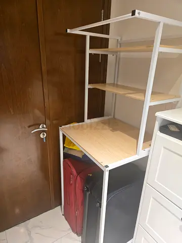 White metal frame wardrobe organizer with shelves — over washing machine