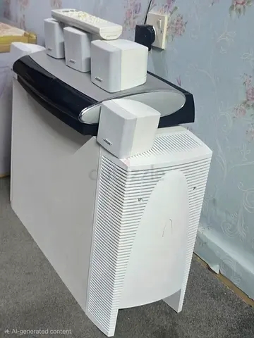 Bose 5.1 sound system , console with remote, all original cables, 5 single cubes4 wall mount.