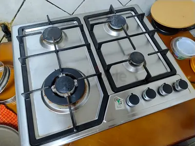Used 4-Burner Stainless Steel Gas Cooktop - Good Working Condition within  warranty period.