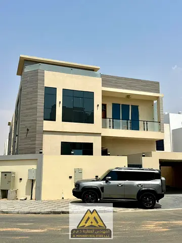 Luxury villa/first occupancy/5 master bedrooms/in the Al Yasmin area behind Al Hamidiya Park, close to all services and main roads