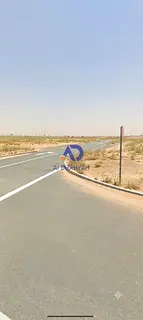Residential land for sale in Muzeir'ah – Al Rahmaniya Suburb; corner plot (facing two streets).