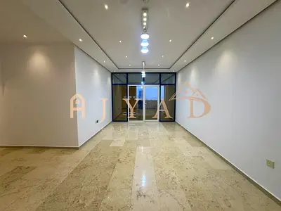 Annual rent: 2BR apartment in Al Nuaimiya near Sharjah border, private parking, central AC, balcony