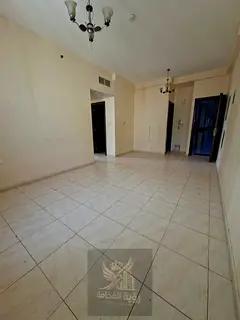 For rent in Sharjah Al Qulaya 2 bedroom apartment with living room 2 bathrooms central AC and gas AE