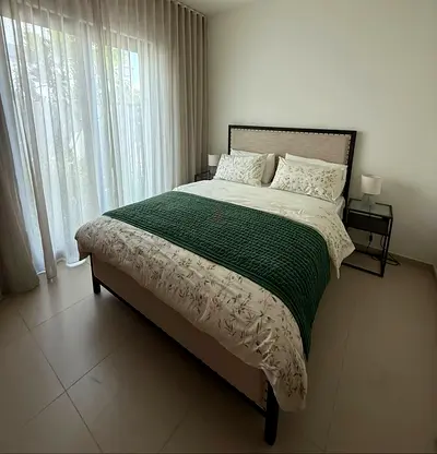 Queen bed frame with upholstered headboard and bedside tables - great condition