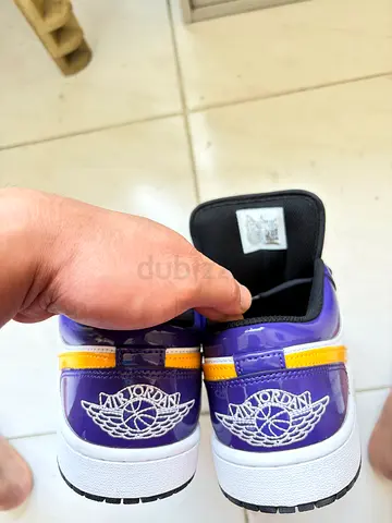 Pair of purple & yellow Air Jordan 1 Low sneakers, used - size not specified