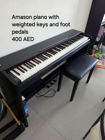Amason digital piano with weighted keys and bench - 400 AED