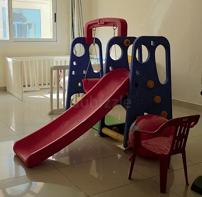 Indoor kids slide and playset with swing - good condition.
