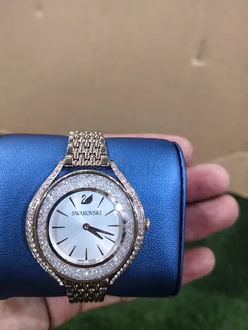 Swarovski women's crystal-studded gold-tone wristwatch, working condition