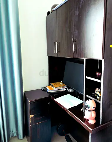 Dark wood study desk with overhead cabinets and shelves - used