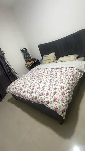 Grey upholstered double bed with padded headboard - good condition without mattress
