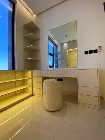 White built-in vanity desk with mirror and shelving - custom made