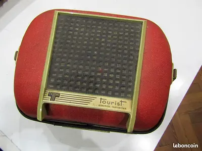 Vintage Tourist portable transistor radio in red fabric case