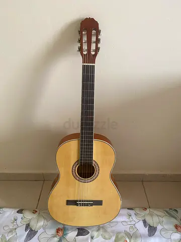 Used classical acoustic guitar - good condition, With Extra Strings, Capo and Bag and Pick
