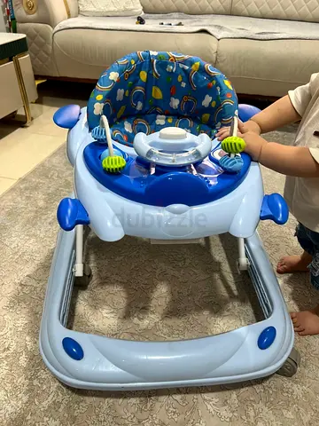 Light blue baby walker with toy tray - gently used