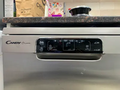 Candy Brava freestanding stainless steel dishwasher, featuring a digital displa 16 place