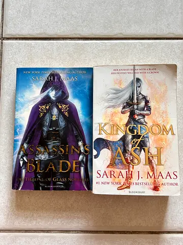 Set of 2 Sarah J. Maas paperbacks — Kingdom of Ash & Assassins blade