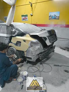 A fully equipped garage with painting, bodywork, and brake pads, workers' accommodation, and a prime