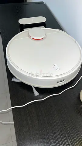 White robotic vacuum cleaner with charging dock - lightly used