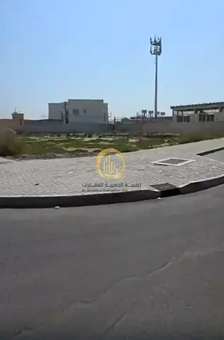 For sale: residential land in the Al-Tarfa area, Sharjah Emirate. Corner plot on two asphalt streets. Parking available on both sides. Close to the ma
