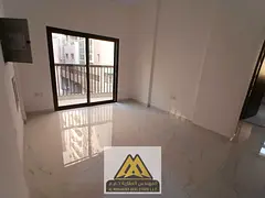 Luxury two-bedroom apartment with a living room | Al Rumaila 1 | Central air conditioning | Balcony