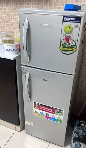 Silver double-door Geepas Refrigerator - Compact top freezer, excellent working condition