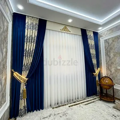 Pair of navy blue velvet curtains with patterned inner panels and sheer voile