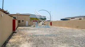 Yard for Rent in Al Sajaa | 25 kW | Office, Kitchen & 2 Bathrooms | Ideal for Storage | 7,000 Sq. Ft