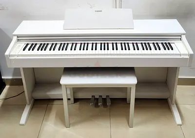 The Casio AP-270WE is an 88-key white digital upright piano from the Celviano series, featuring