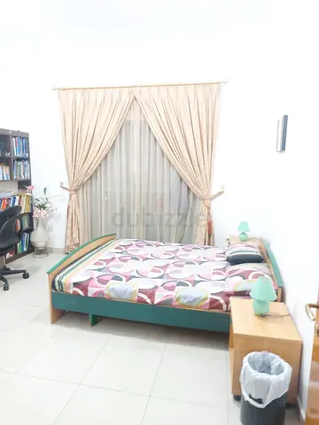 Queen wooden bed with mattress and bedside table — good condition