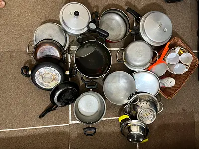 Mixed set of used pots, pans and kitchen cookware - various sizes