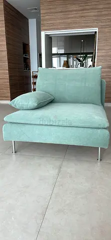 Single modern lounge chair in mint green fabric, good condition