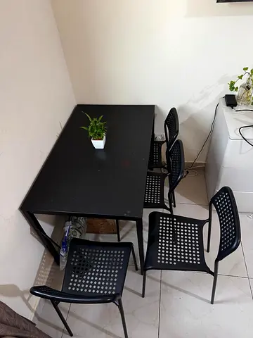Well maintained Black Dining Table with 4 Matching Chairs in good condition. Available for pickup