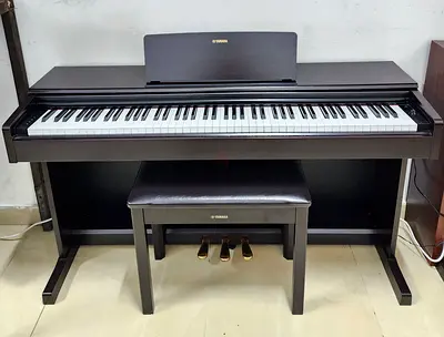 The Yamaha Arius YDP-145R is an 88-key digital home piano in a dark rosewood finish. It features