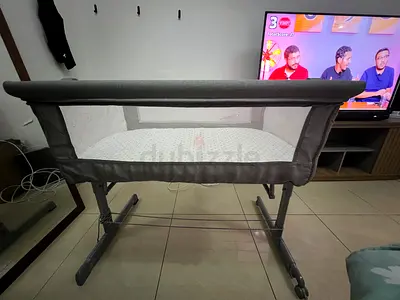 Lightweight bedside baby crib/side sleeper - grey, gently used