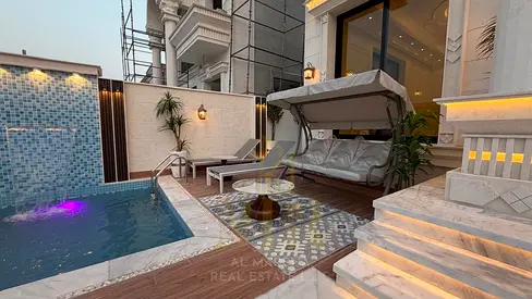 Dream villa in Al Muwaihat 2, classic design, two floors and a roof, close to all services, with a
