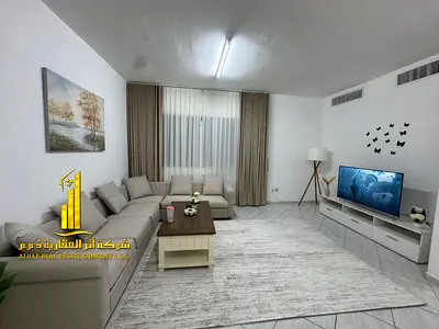 Luxury apartment, second occupancy. Two bedrooms, living room, and open balcony. Ajman, Al Rashidiya. Fully furnished for monthly rent.