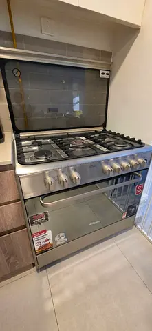 Stainless Steel 5-Burner Gas Range with Oven - Good Condition. All hobs working. No issues.