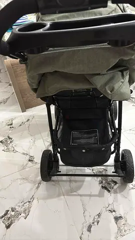 Lightly used standard baby stroller with storage basket and cup holder