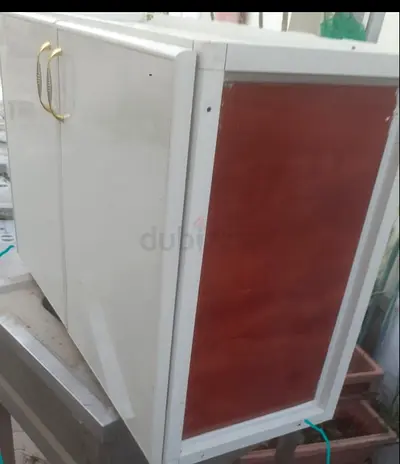 White wooden storage cabinet with double doors — good condition
