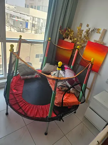 Kids indoor mini trampoline with safety net - good condition