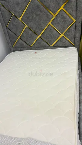 Queen mattress in good condition with modern upholstered headboard