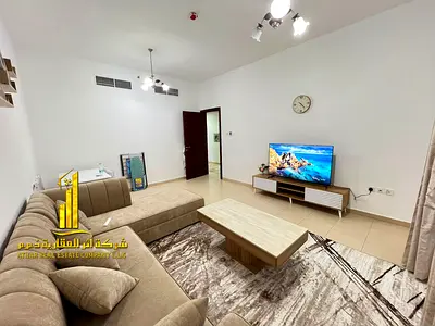 Luxurious two-bedroom apartment with a living room, fully furnished with brand new, high-end furniture, and includes private parking.