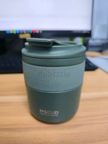 Used insulated travel mug cup - green