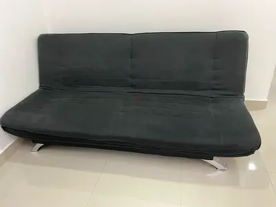Dark grey convertible futon sofa bed with metal legs